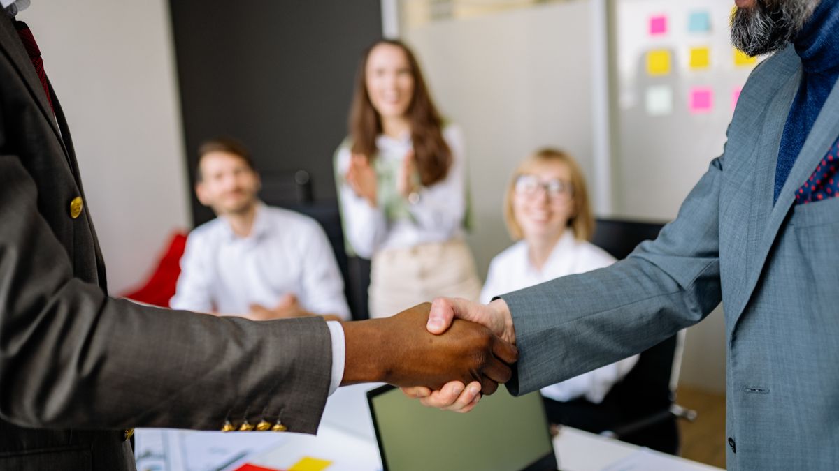 Two business people shaking hands