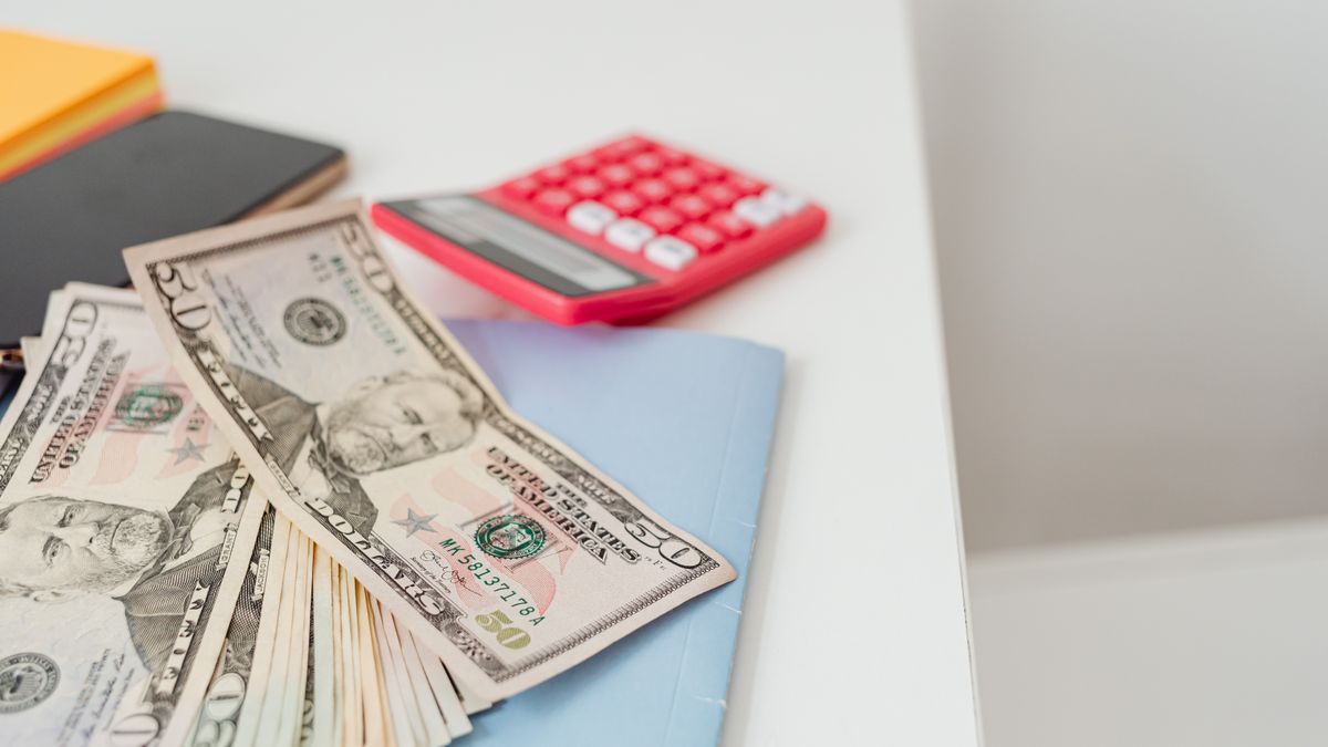 Calculator and budget notes on a desk